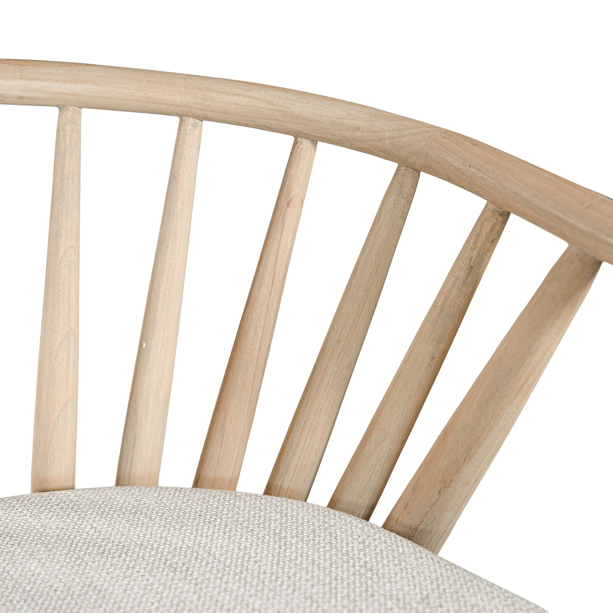 Lightwood spindle dining chair with a curved backrest and white upholstered seat, showcasing a modern yet timeless design. Crafted from solid wood, this chair brings a refined, natural aesthetic to any dining or living space