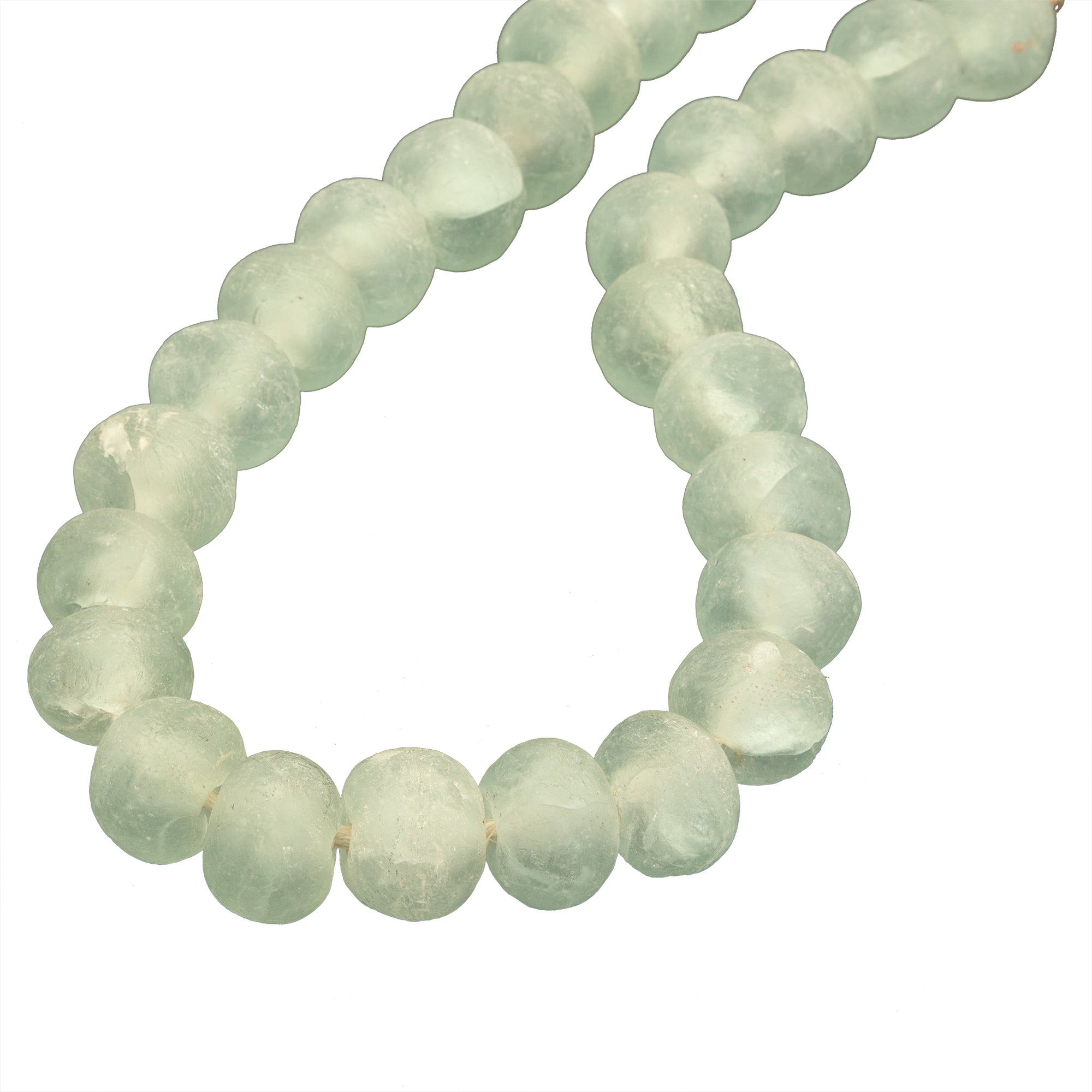 Decorative strand of recycled glass beads in a soft green hue, displayed on a minimalist black metal stand. A unique accent piece that adds texture and artisanal charm to any interior styling