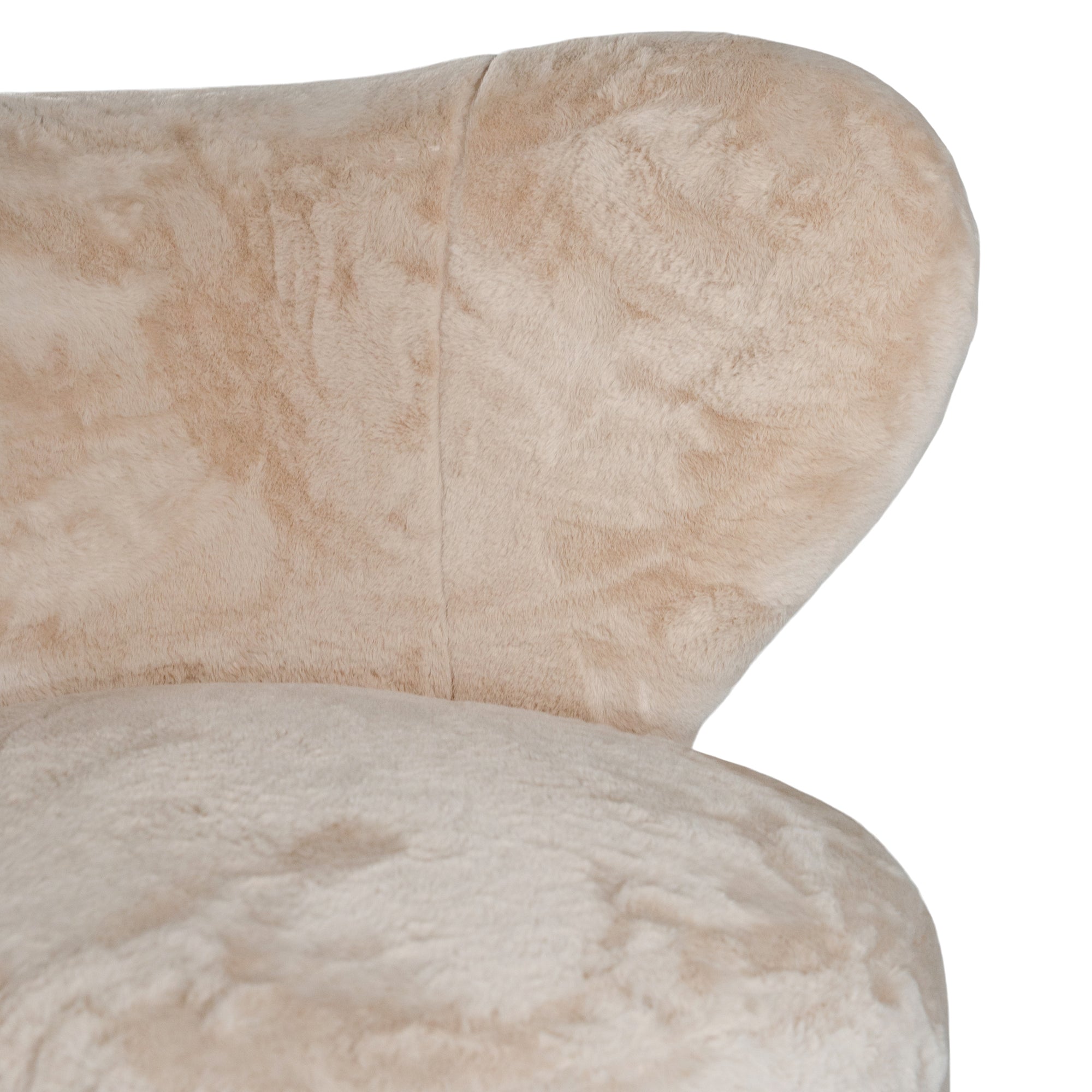 Luxurious beige teddy swivel armchair featuring a sculptural curved back and plush upholstery. A cosy and stylish accent chair designed for comfort and modern interiors