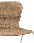 Contemporary dining chair with a sleek white metal frame and a handwoven natural rattan seat and backrest, offering a stylish and comfortable alfresco seating option