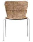 Contemporary dining chair with a sleek white metal frame and a handwoven natural rattan seat and backrest, offering a stylish and comfortable alfresco seating option