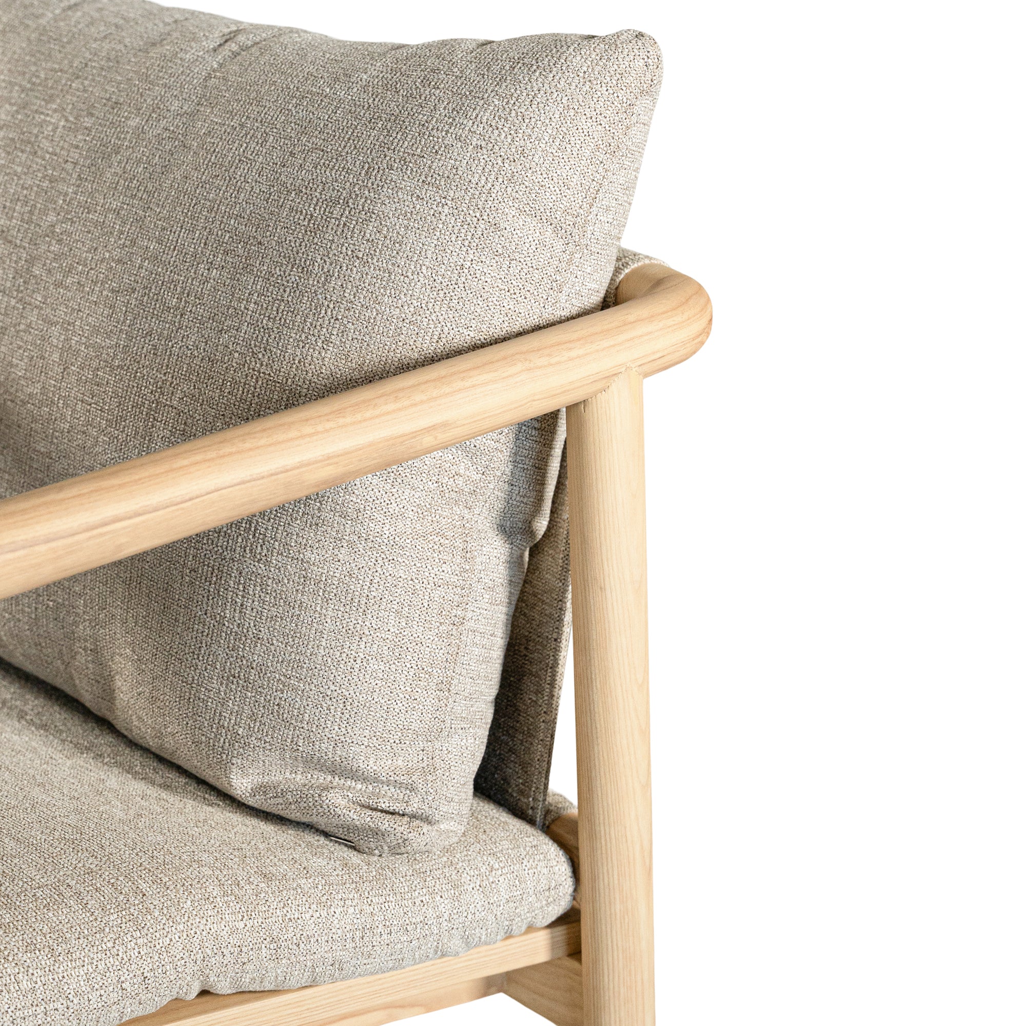 Minimalist ash armchair with natural linen cushions, featuring a sleek Scandinavian-inspired frame