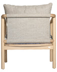 Minimalist ash armchair with natural linen cushions, featuring a sleek Scandinavian-inspired frame