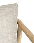 Minimalist ash armchair with natural linen cushions, featuring a sleek Scandinavian-inspired frame