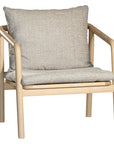 Minimalist ash armchair with natural linen cushions, featuring a sleek Scandinavian-inspired frame