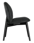 Side profile of a modern black dining chair with sleek black timber legs, offering a sophisticated and contemporary seating option