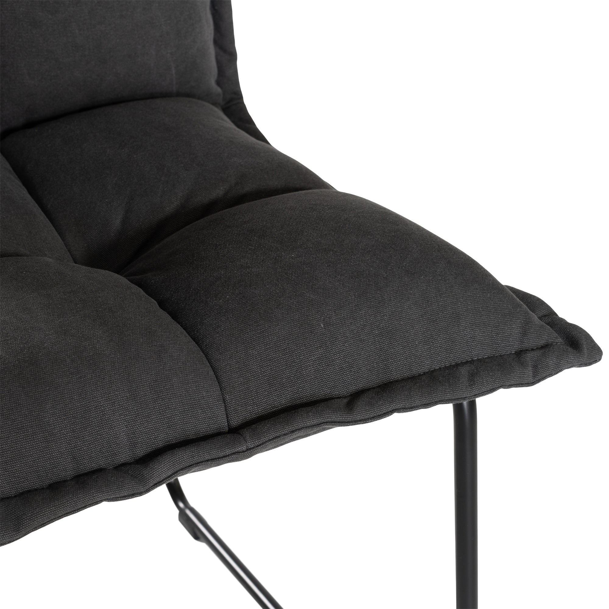 Black cushioned dining chair with a plush padded seat and high backrest, supported by a sleek black metal frame for a contemporary and comfortable seating option