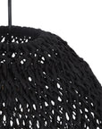 Black woven rattan pendant light with a dome shape, featuring an open-weave design that casts a warm, ambient glow, perfect for modern interiors