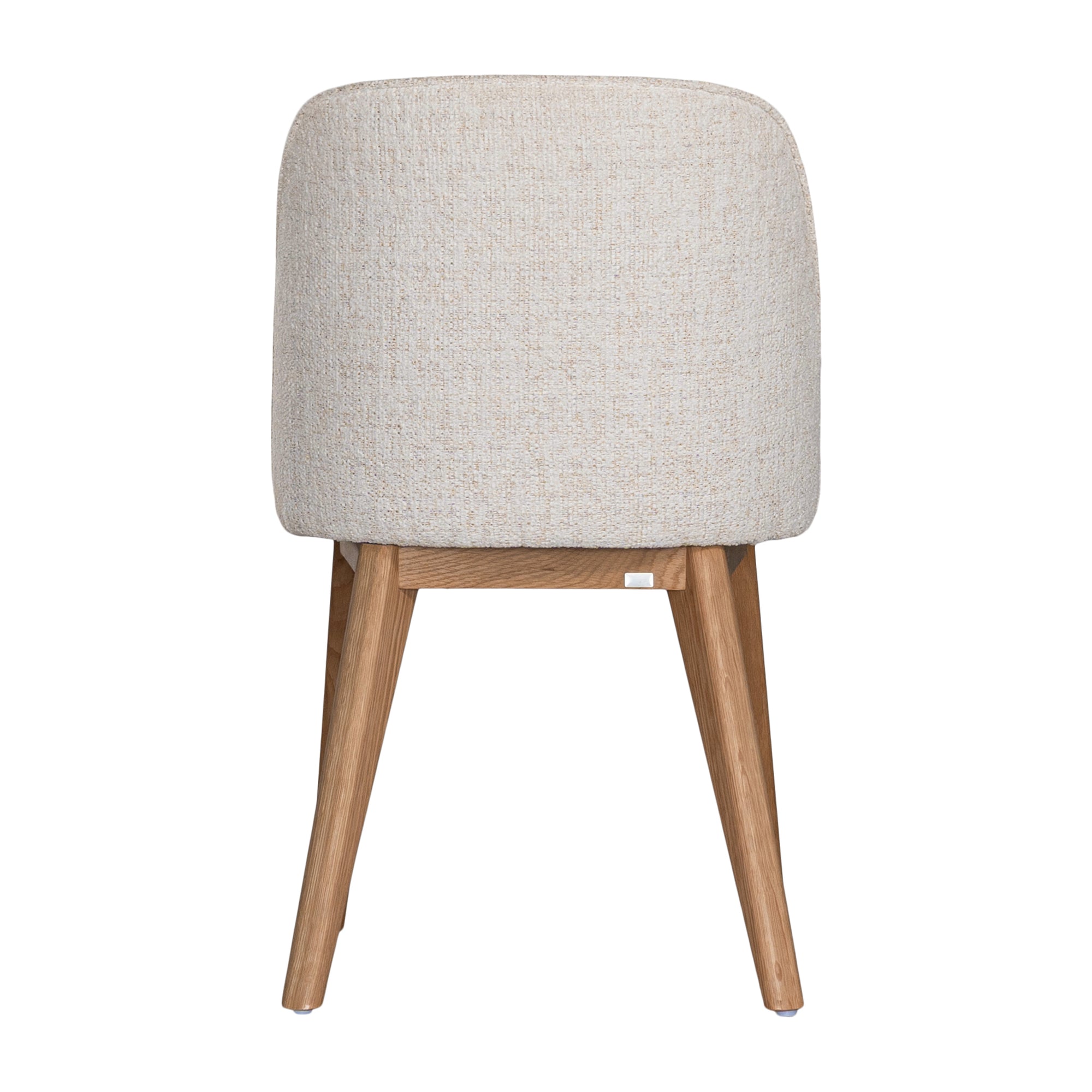 Elegant boucle dining chair with a curved upholstered backrest and plush cushioned seat, supported by tapered lightwood legs. A refined and comfortable seating option for modern dining spaces