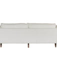 A modern white boucle sofa from KULALA Living, designed with plush cushioning and natural timber legs. A statement piece for contemporary interiors, offering both style and comfort