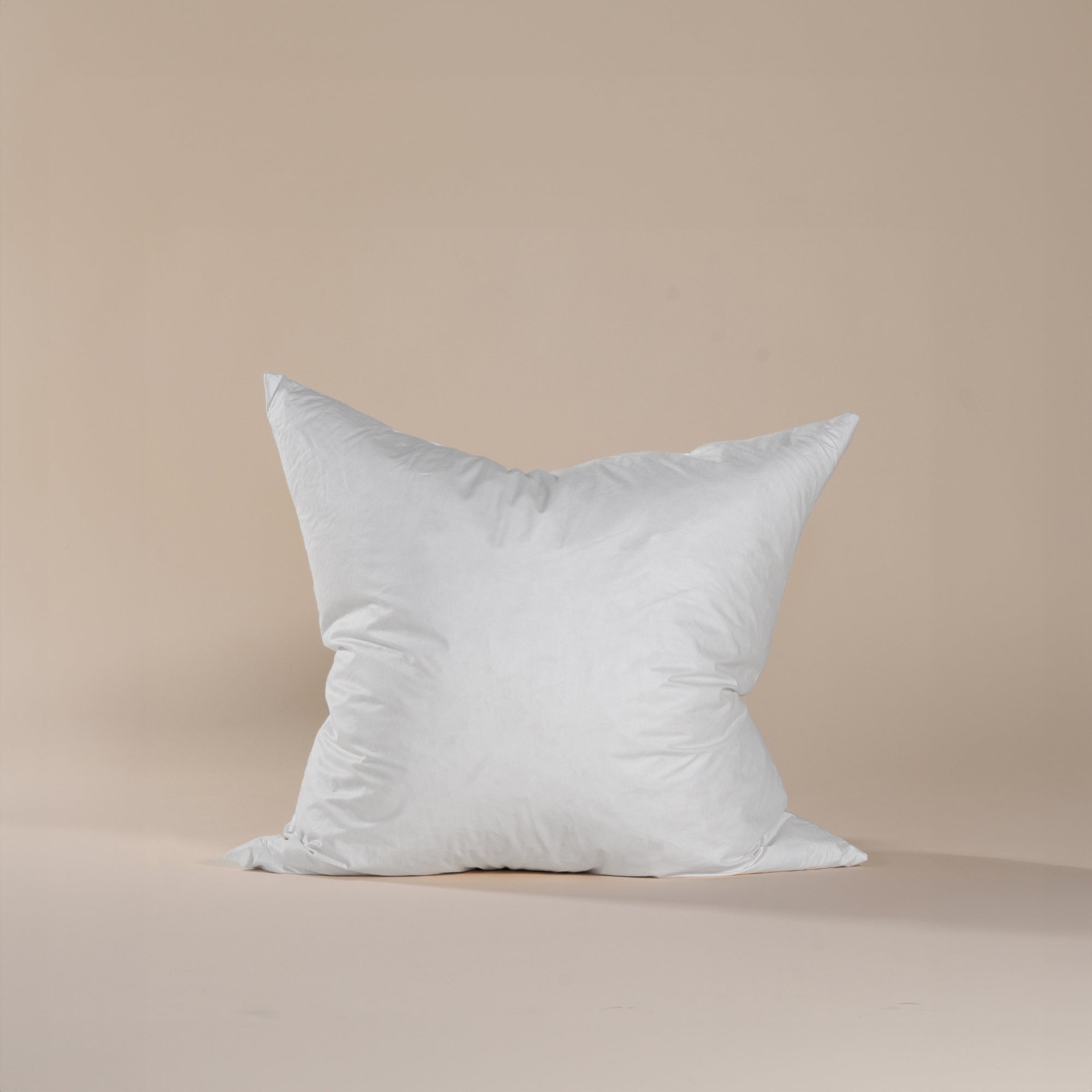 60cm x 60cm plush cushion insert in crisp white, designed for luxurious comfort and optimal shape retention in cushion covers