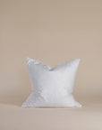 A plush feather-filled cushion insert in a crisp white cover, designed to provide soft yet supportive comfort. Perfect for enhancing the shape and feel of decorative cushions.