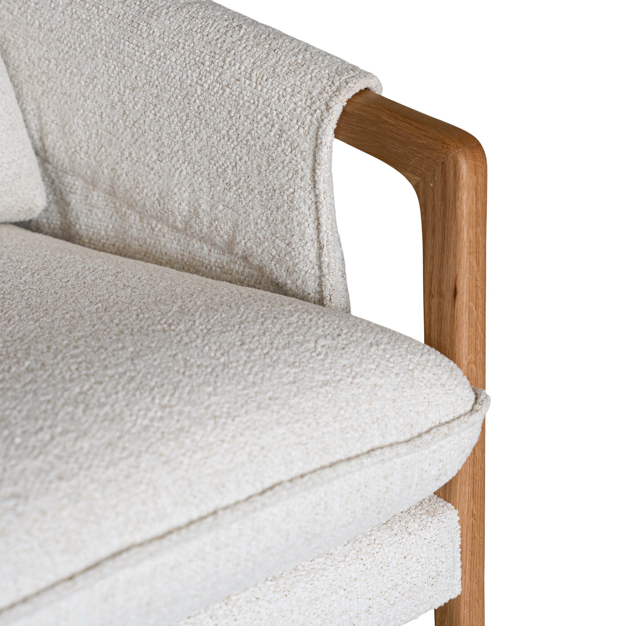 A sophisticated Hamptons-style armchair from KULALA Living, featuring a natural oak frame and soft linen upholstery in a neutral hue. Designed for both comfort and elegance, perfect for contemporary and coastal interiors