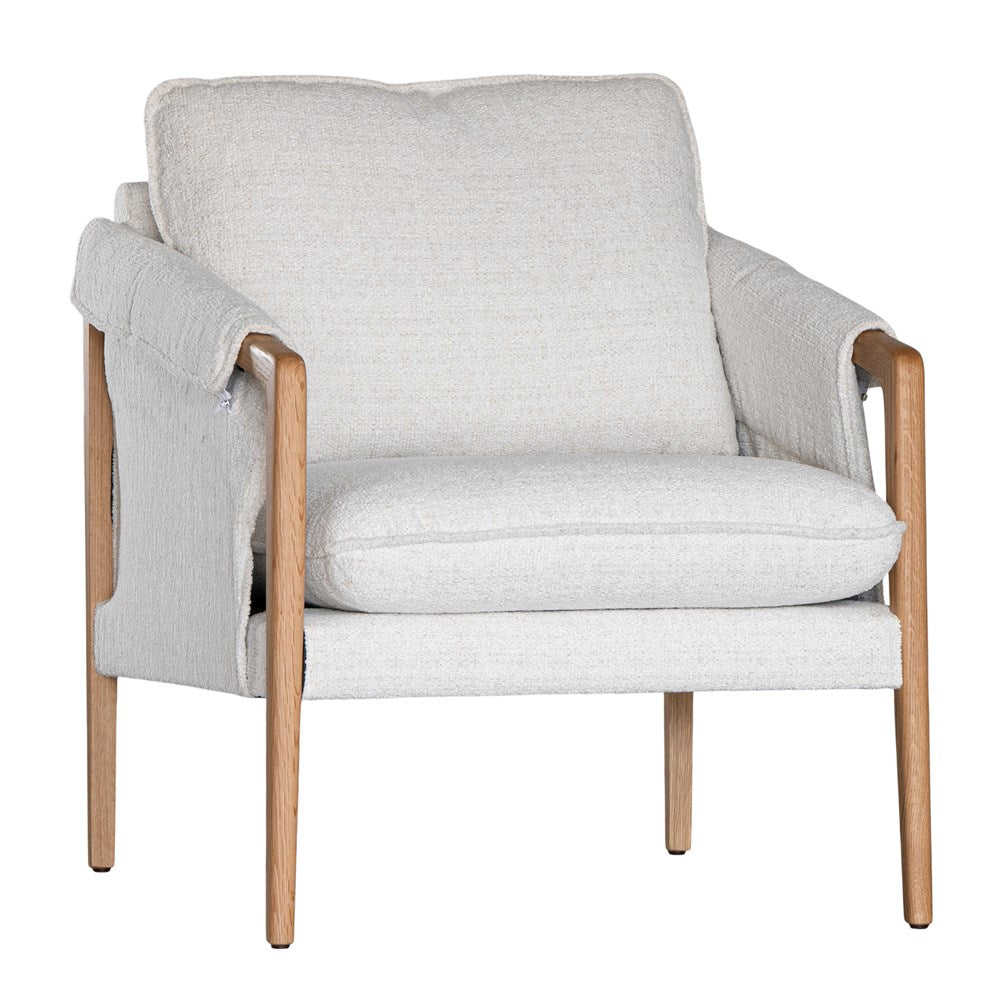 A sophisticated Hamptons-style armchair from KULALA Living, featuring a natural oak frame and soft linen upholstery in a neutral hue. Designed for both comfort and elegance, perfect for contemporary and coastal interiors