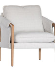 A sophisticated Hamptons-style armchair from KULALA Living, featuring a natural oak frame and soft linen upholstery in a neutral hue. Designed for both comfort and elegance, perfect for contemporary and coastal interiors