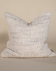 Handwoven neutral-toned cushion cover with rich texture, adding warmth and an organic touch to any space