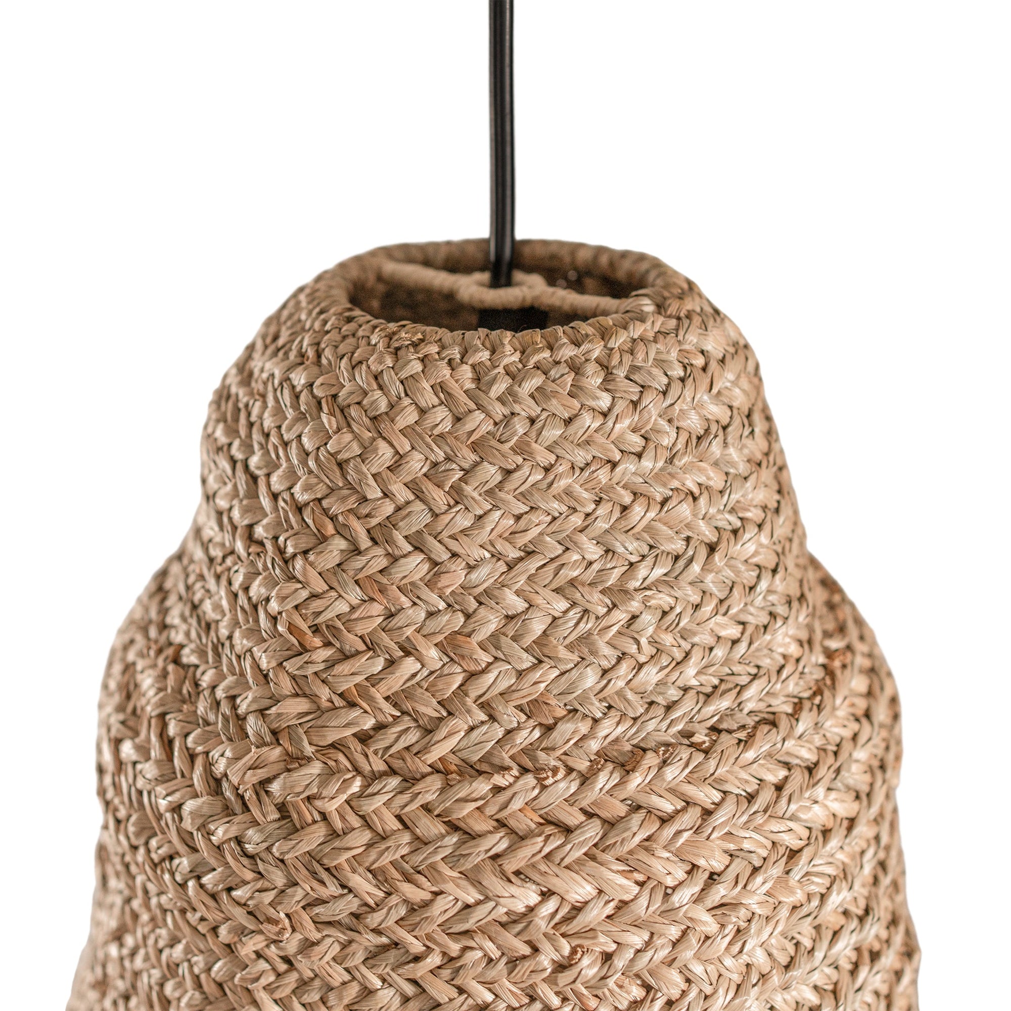 A natural handwoven jute pendant light with a conical silhouette and fringed base, suspended from a black cord. The organic texture and earthy tones create a relaxed, coastal-inspired aesthetic, perfect for enhancing bohemian, rustic, or modern interiors