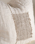 Handcrafted linen cushion in a soft cream hue, featuring a textured woven centre panel for a rustic yet refined aesthetic