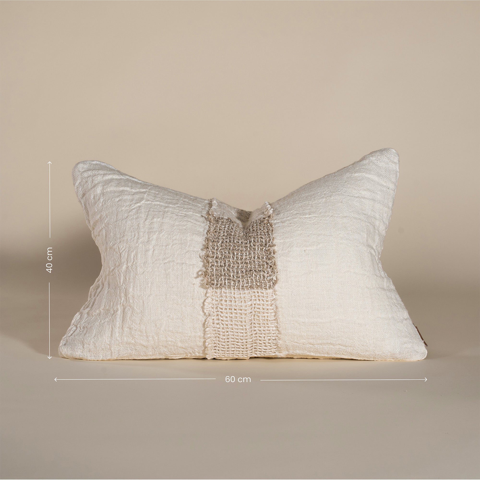 Handcrafted linen cushion in a soft cream hue, featuring a textured woven centre panel for a rustic yet refined aesthetic