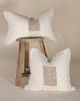 Handcrafted linen cushion in a soft cream hue, featuring a textured woven centre panel for a rustic yet refined aesthetic