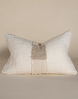 Handcrafted linen cushion in a soft cream hue, featuring a textured woven centre panel for a rustic yet refined aesthetic