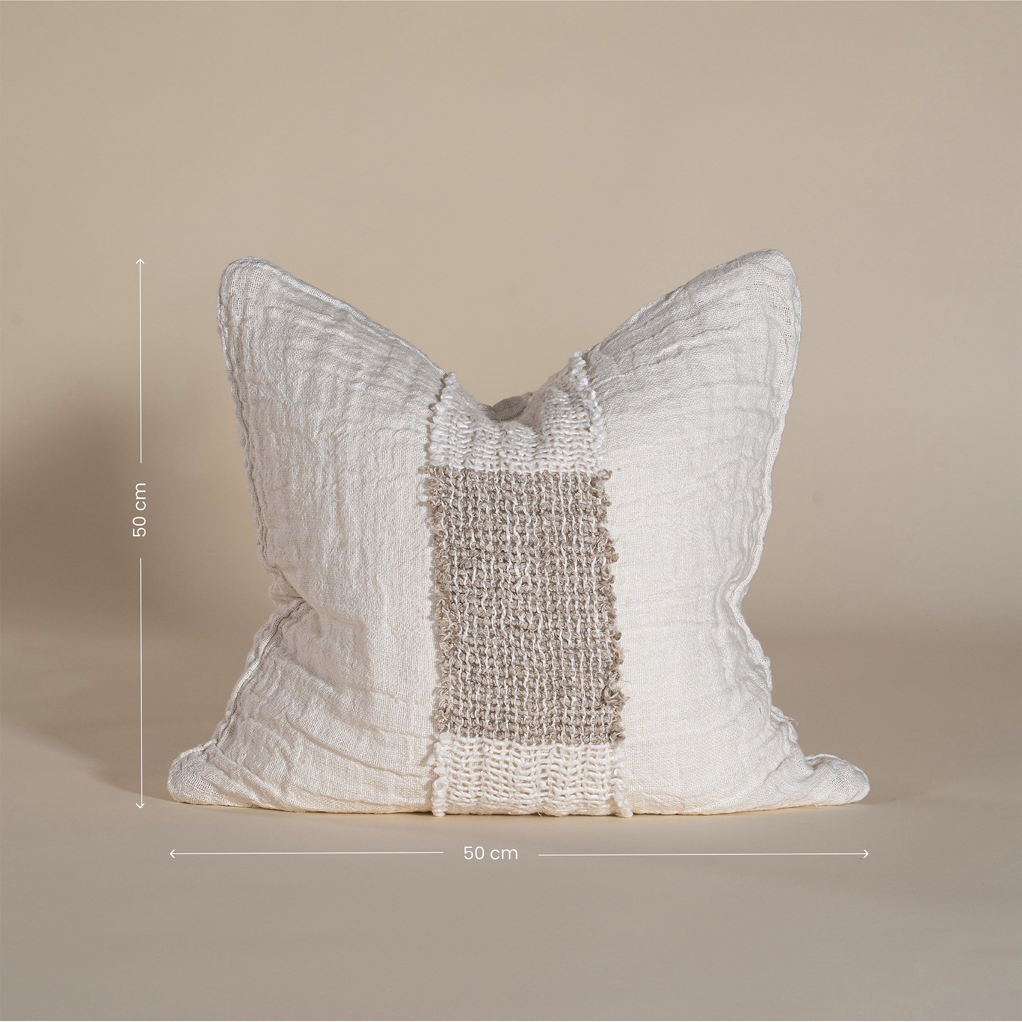 Handcrafted linen cushion in a soft cream hue, featuring a textured woven centre panel for a rustic yet refined aesthetic