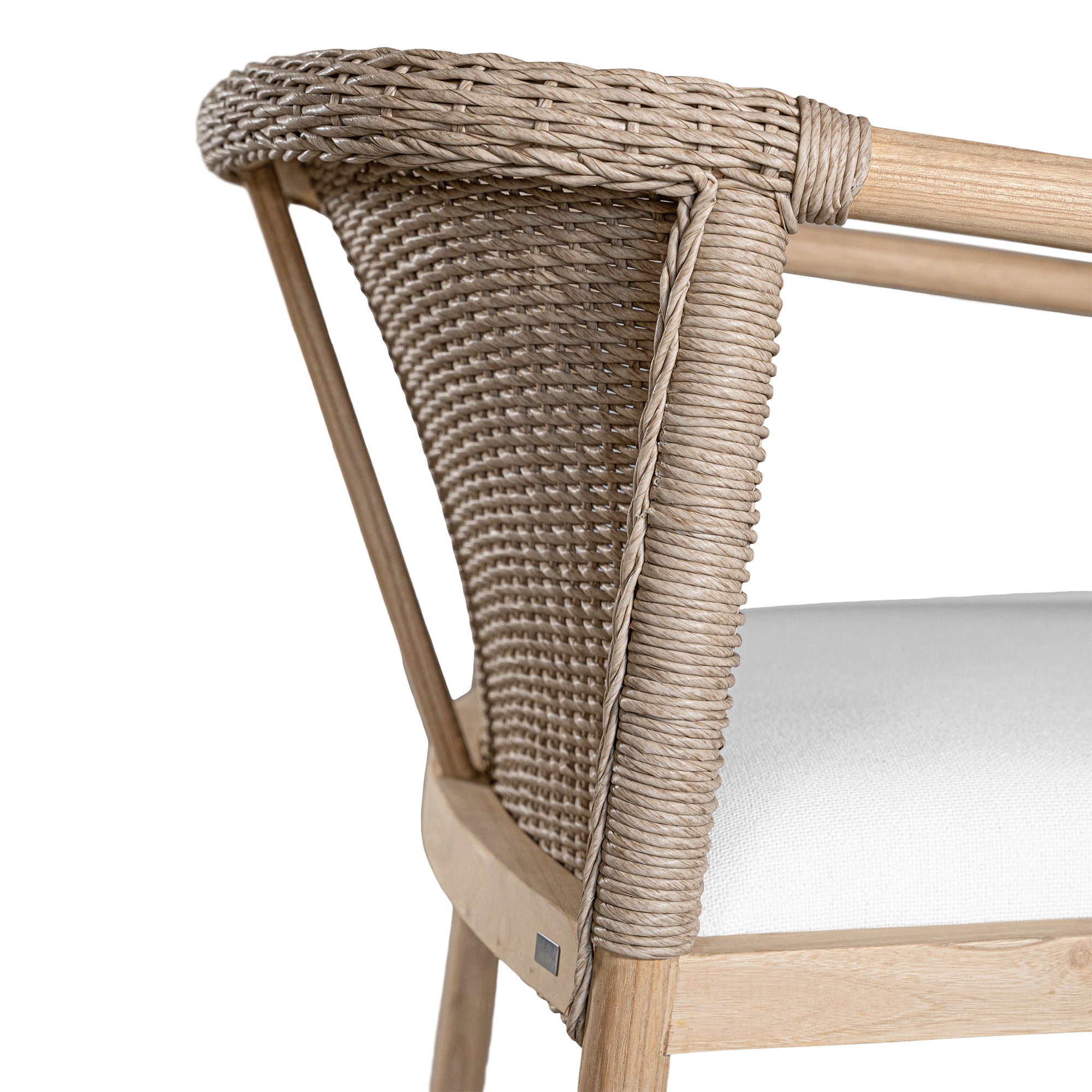 Modern woven armchair with a light timber frame and a plush white seat cushion. A perfect blend of natural texture and contemporary design for relaxed living spaces