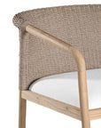 Modern woven armchair with a light timber frame and a plush white seat cushion. A perfect blend of natural texture and contemporary design for relaxed living spaces