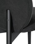 Contemporary black lounge chair with a curved backrest and plush cushioning, supported by sleek black timber legs.