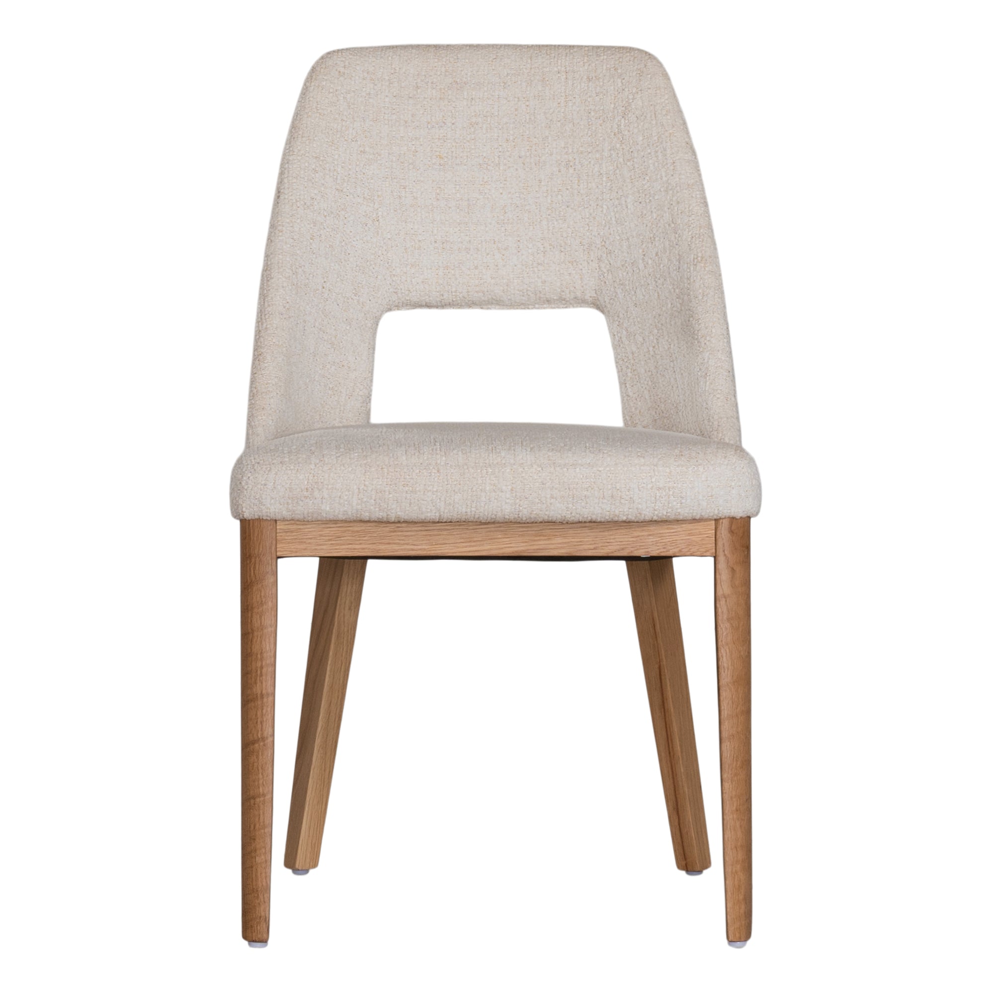 A contemporary dining chair from KULALA Living, featuring soft boucle upholstery and sturdy natural timber legs. Designed for comfort and style, perfect for modern dining spaces