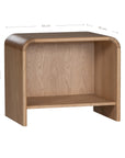 A modern oak bedside table from KULALA Living, featuring a curved silhouette and open storage shelf. Crafted from natural wood, this minimalist piece enhances any bedroom with its warm, organic aesthetic