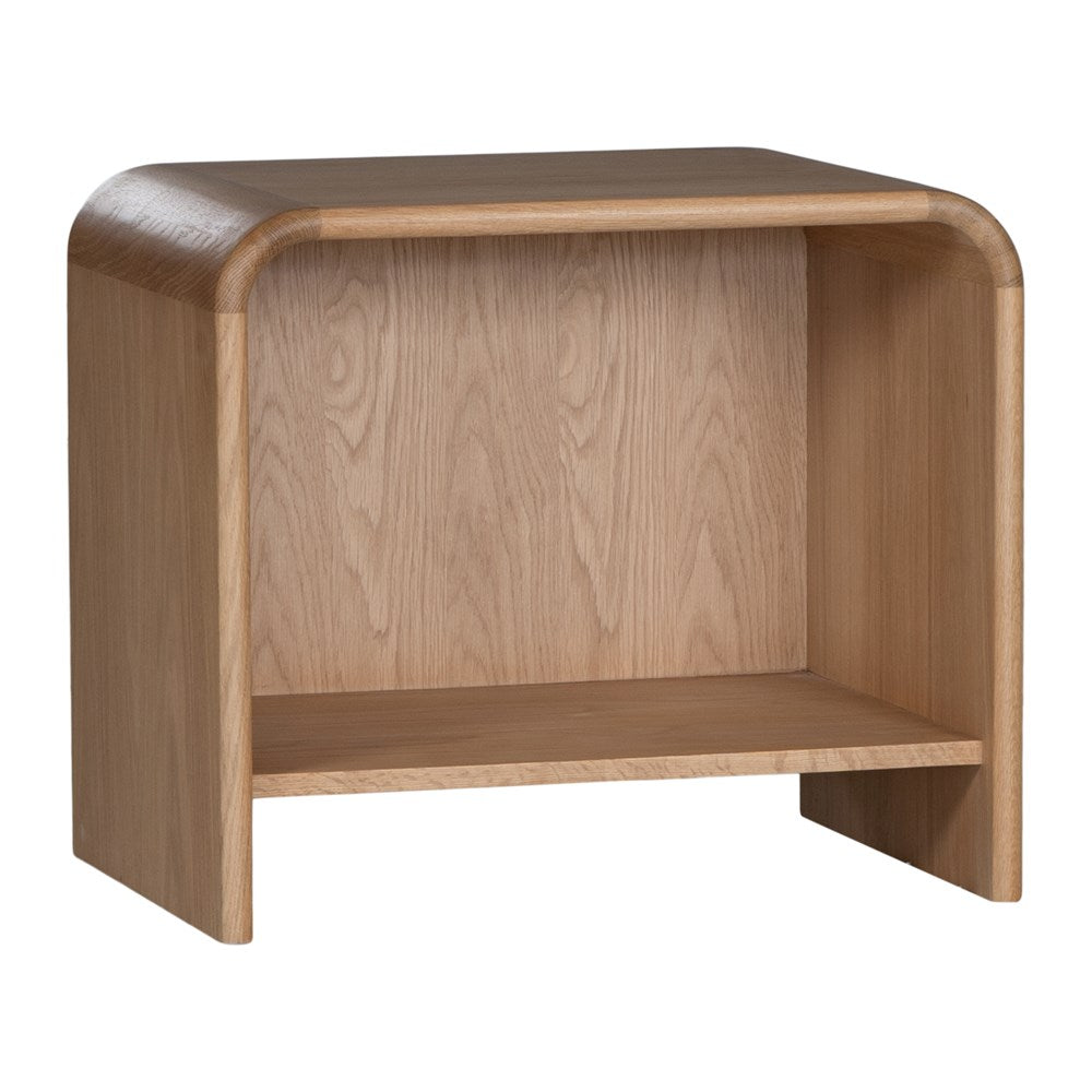 A modern oak bedside table from KULALA Living, featuring a curved silhouette and open storage shelf. Crafted from natural wood, this minimalist piece enhances any bedroom with its warm, organic aesthetic