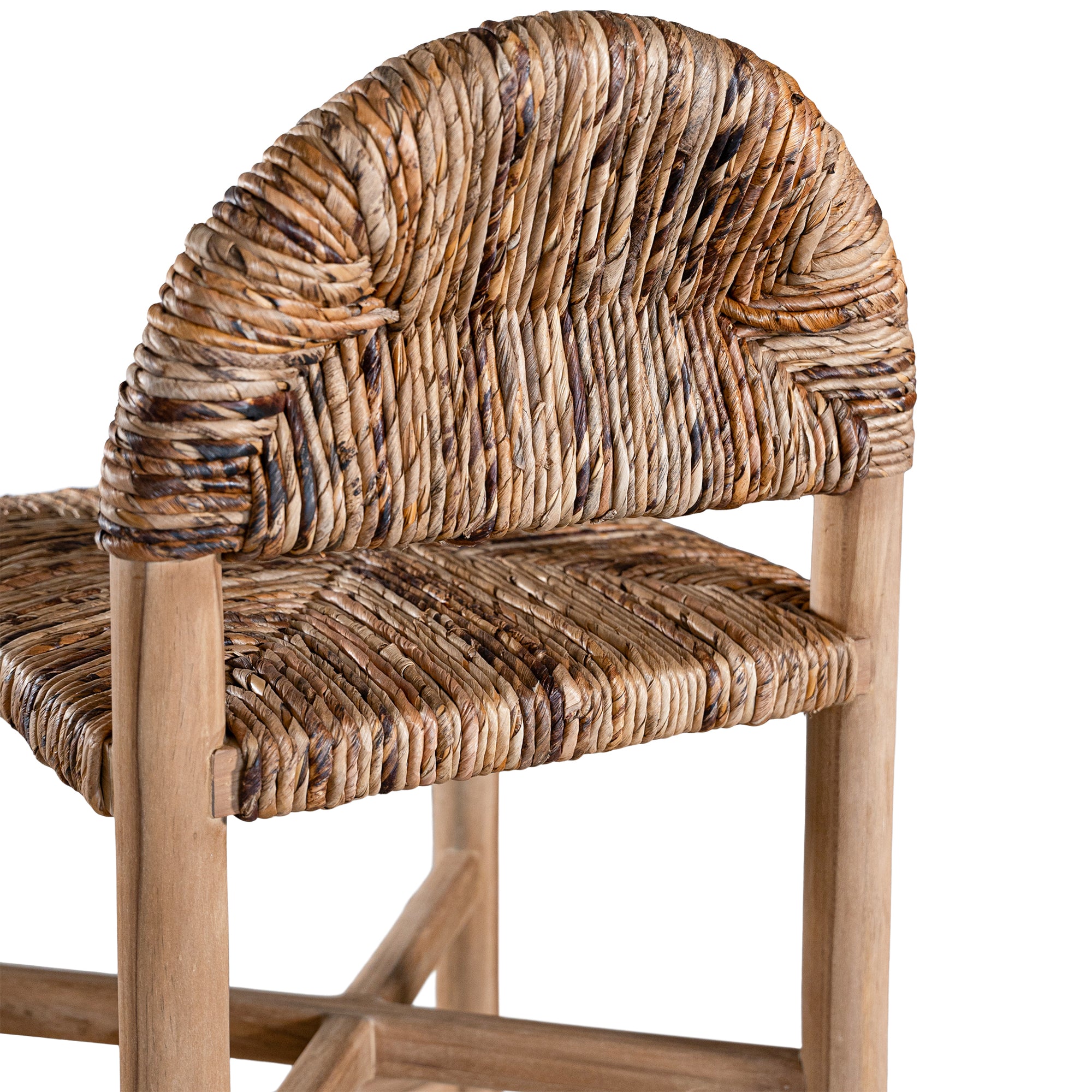 Handwoven rattan bar stool with a sturdy teak frame and curved backrest, showcasing organic texture and artisanal craftsmanship