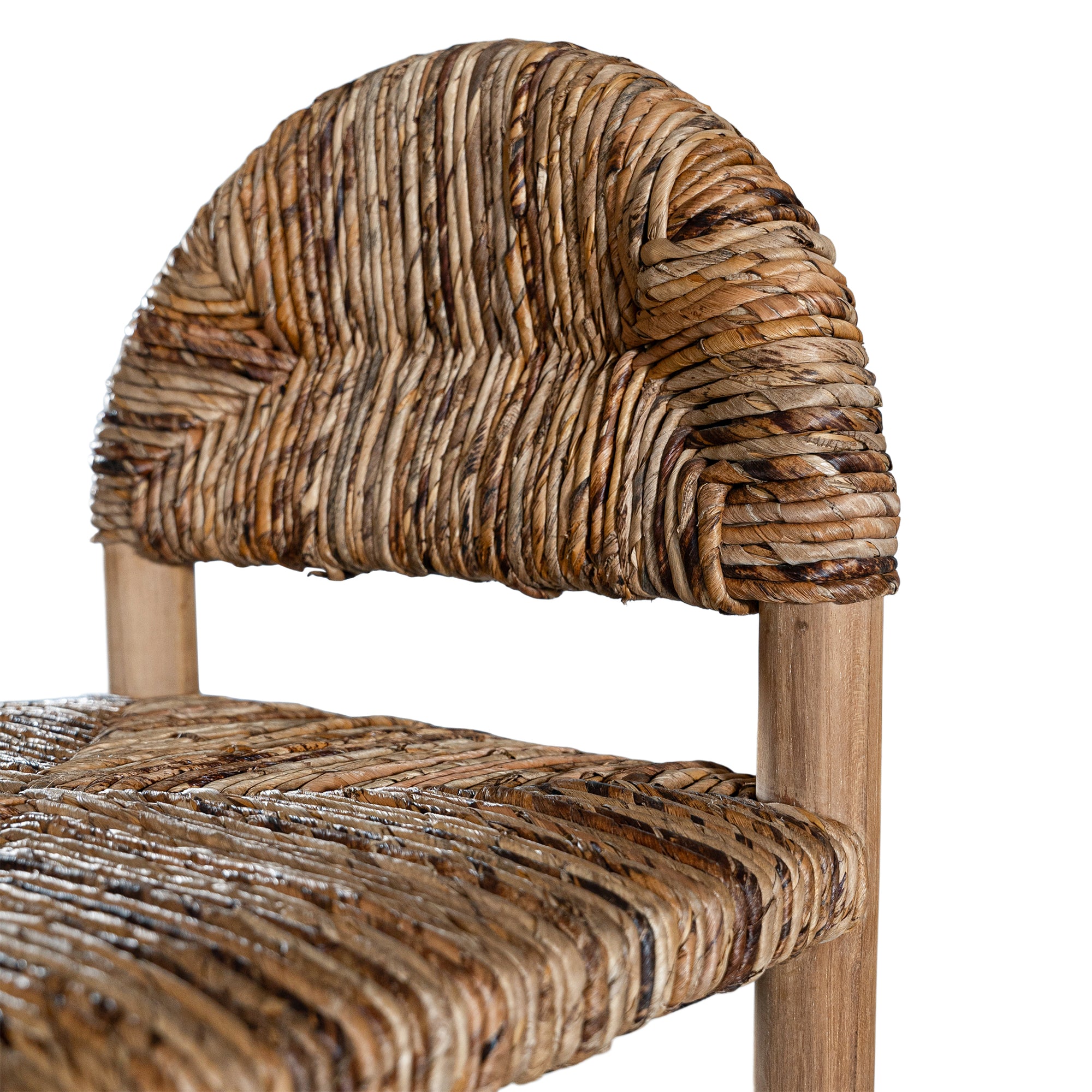 Handwoven rattan bar stool with a sturdy teak frame and curved backrest, showcasing organic texture and artisanal craftsmanship