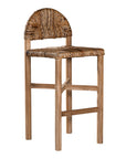 Handwoven rattan bar stool with a sturdy teak frame and curved backrest, showcasing organic texture and artisanal craftsmanship