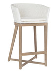 Natural rattan bar stool with a woven backrest, light wood frame, and a cushioned seat, offering a stylish and comfortable seating option for kitchen counters or bars