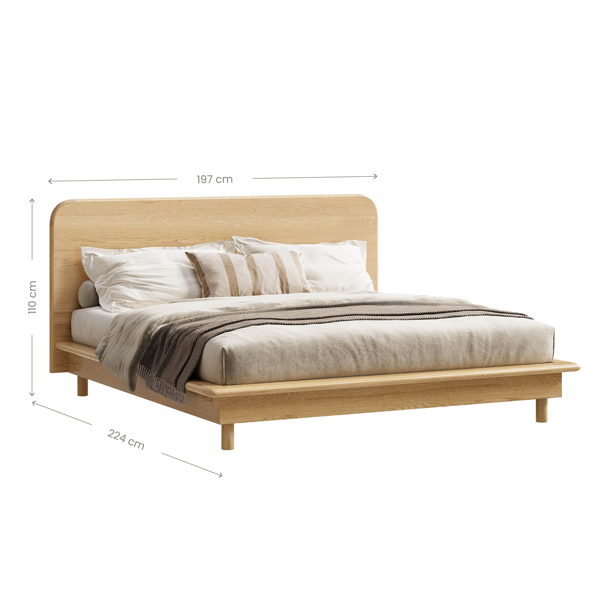 A beautifully crafted oak timber platform bed frame from KULALA Living, featuring a minimalist modern design with a gently curved headboard. Styled with neutral bedding for a serene and inviting bedroom aesthetic