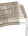 Contemporary outdoor dining chair featuring a sturdy white metal frame with a handwoven rope seat and backrest in a natural tone