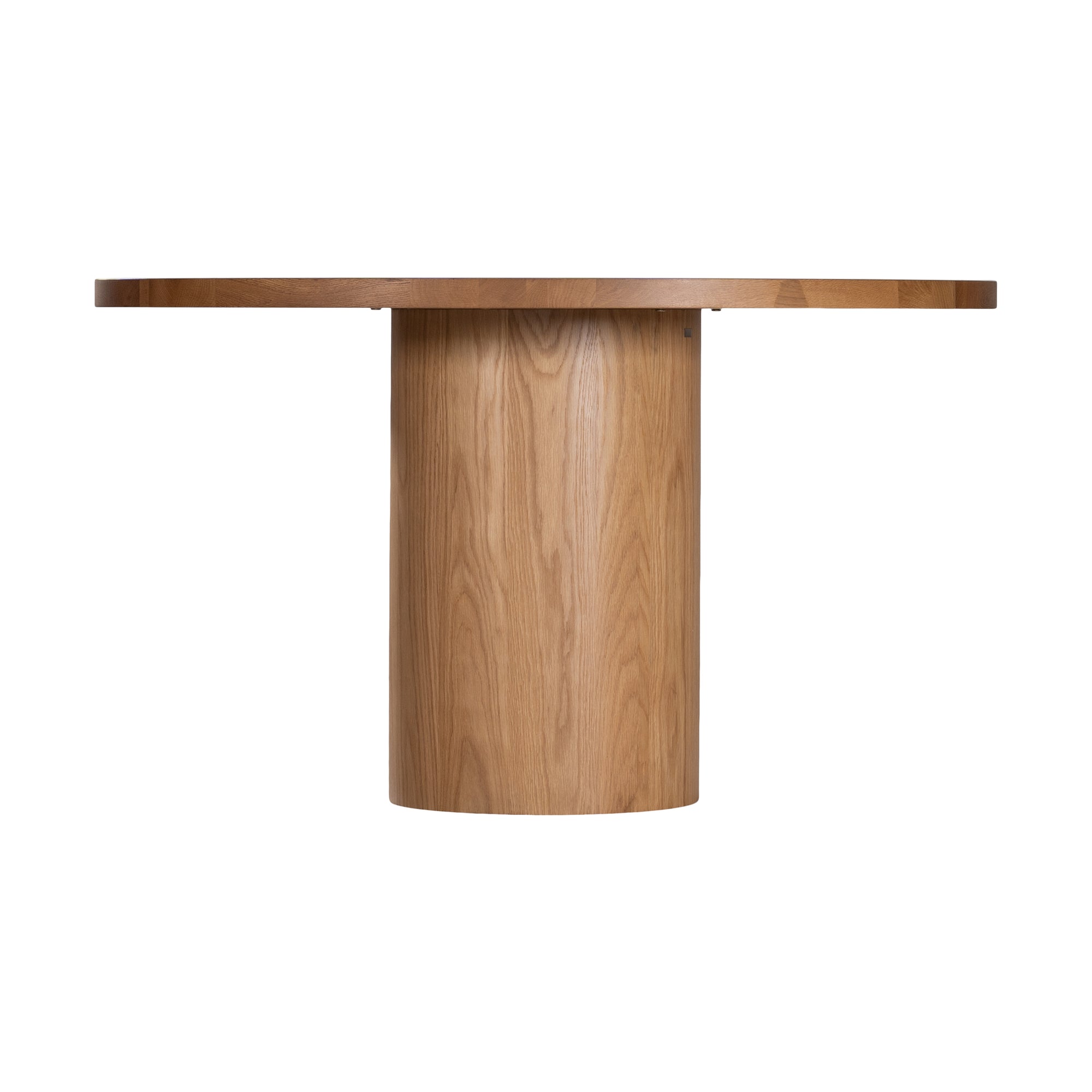 Contemporary round oak pedestal dining table featuring a sleek, minimalist design with a solid cylindrical base and smooth tabletop