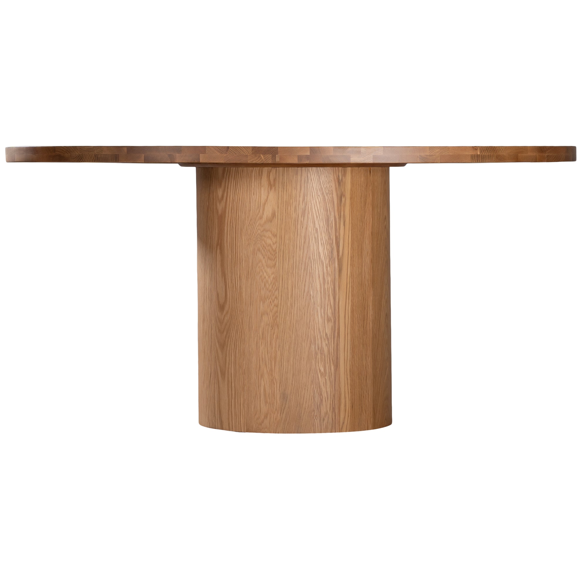 Contemporary round oak pedestal dining table featuring a sleek, minimalist design with a solid cylindrical base and smooth tabletop