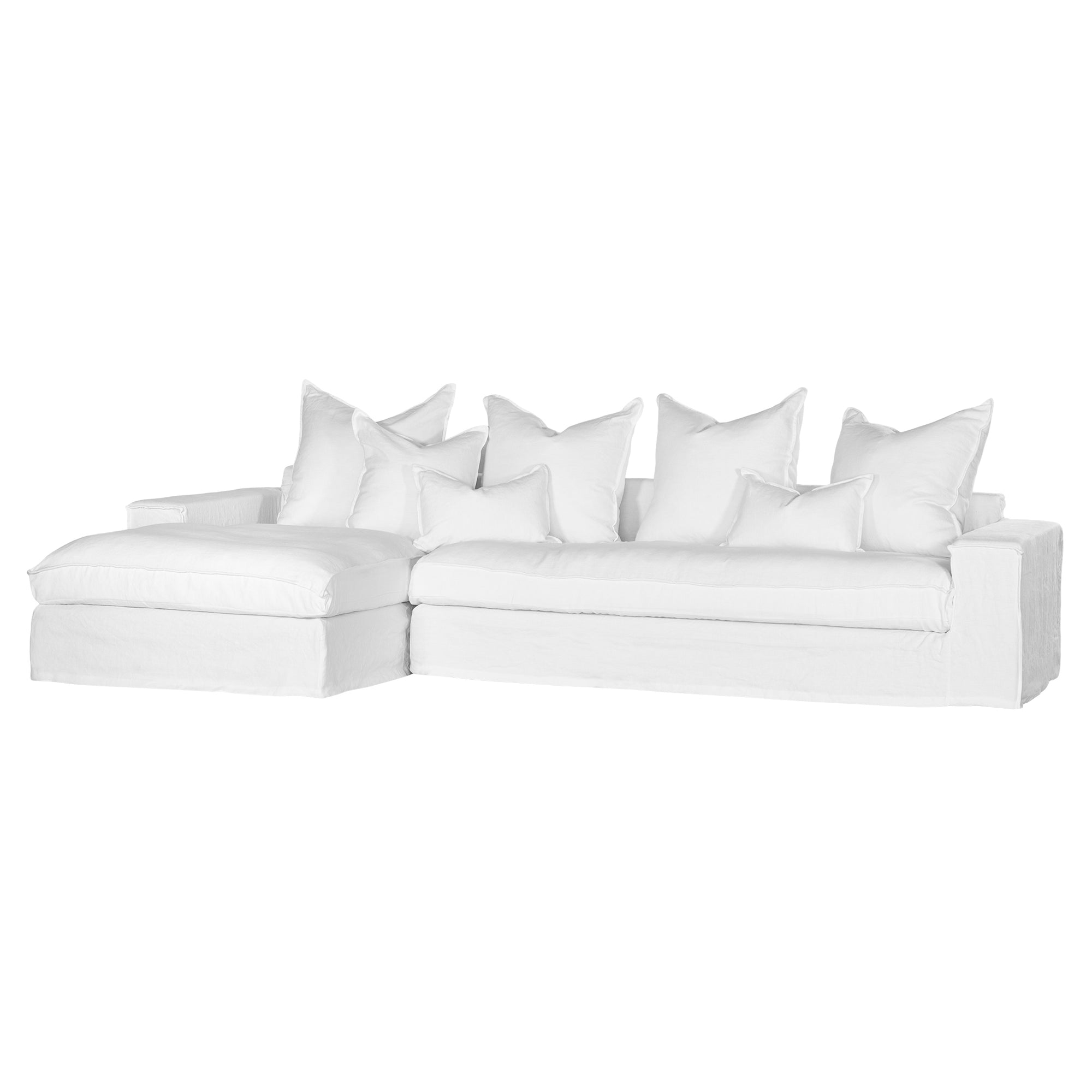 White linen slipcover sectional sofa with plush cushions. A timeless, versatile design offering relaxed elegance and everyday comfort