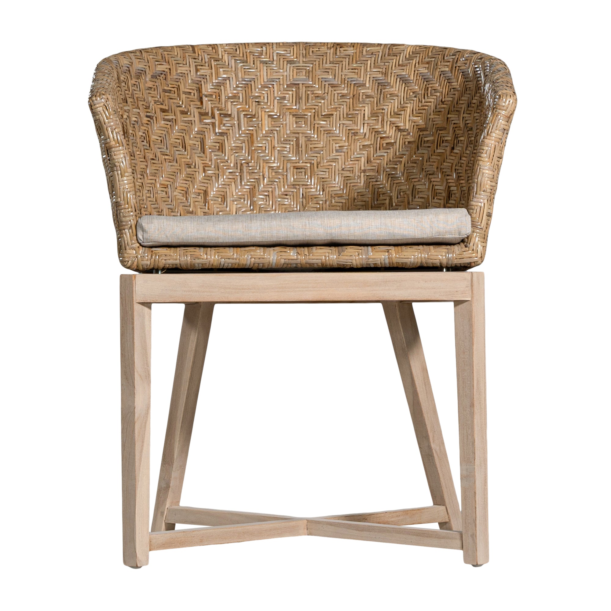 KULALA Living handwoven rattan dining chair with a curved backrest, natural wood legs, and a neutral seat cushion, blending coastal and contemporary design